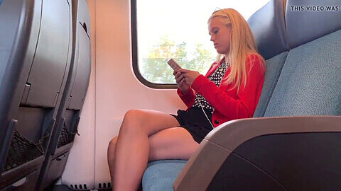 Gorgeous blonde shows off her sexy legs in the train