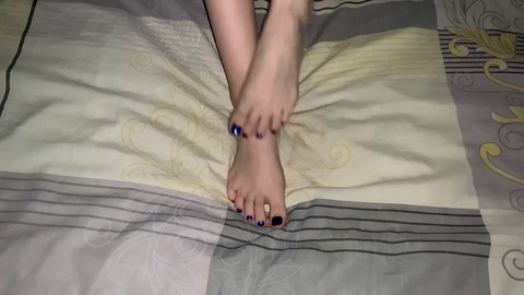 Gloria Gimson seduces with her stunning legs and blue pedicure in bed