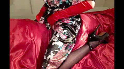 Shemale CD in satin skirt tears up satin cushion in a solo session