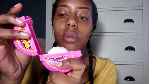 Ebony babe indulges in some sticky chewing fun
