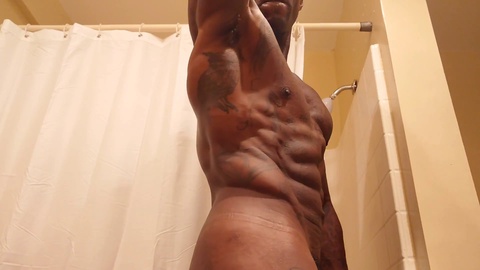 Solo black stud Hallelujah Johnson strokes his big black cock with a clear stroker