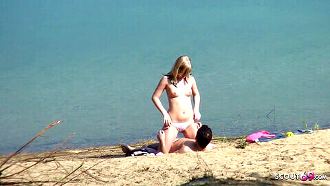 Genuine teenage couple caught on a German beach, hidden cam threesome with a stranger