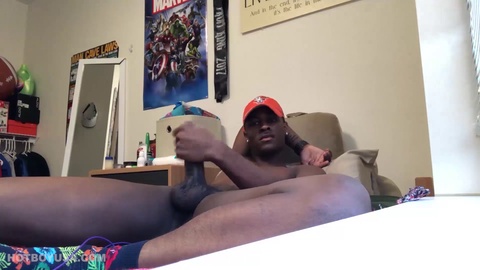 Young black stud Chris strokes his big dick solo