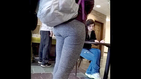 Candid college girl with a juicy phat ass flaunts her curves in gray leggings