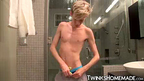 Skinny young twink enjoys hot solo shower session with his big cock