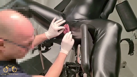 Gynecologist inserts catheter into MILF's pussy on examination chair