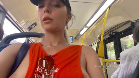 Naughty babe flaunts her natural tits while taking a stroll through the city