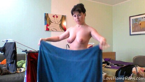 Naughty milf takes care of her laundry while teasing on cam