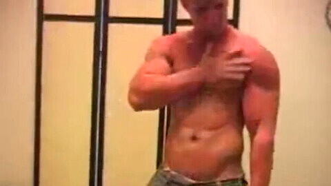 Muscular gay hunk Mark Dalton enjoys a solo session of stripping, flexing, and stroking