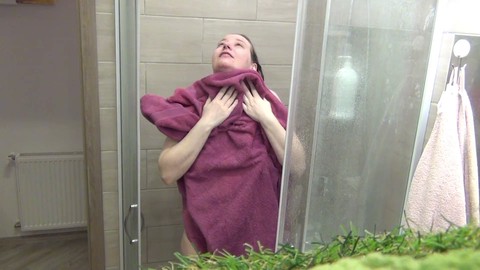 Hot blonde with natural tits showers and takes a bath