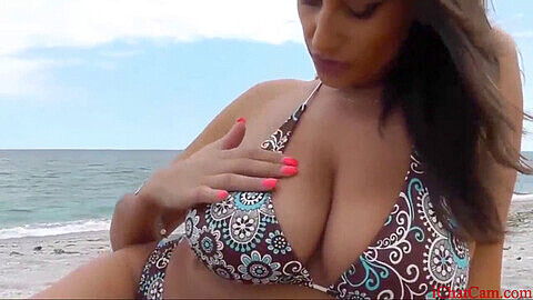 Busty Sensual Jane gives a beach blowjob and titjob in POV