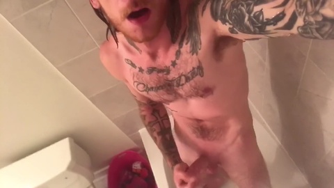 Hot dude with tattoos strokes his hard cock for an explosive money-shot after a steamy shower