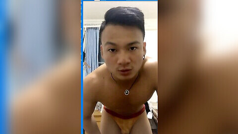 Chinese gay muscle stud masturbates in front of the camera