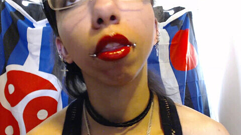 Seductive lips covered in bright red lipstick dripping with an overflowing pool of saliva and drool