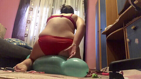 Curvy young BBW teen pops balloons while juggling in a delightful balloon fetish performance
