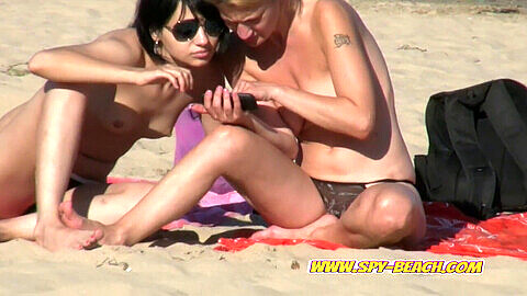 Close-up, nude beach girls, voyeur