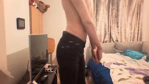 Slim teen shows off his ribs and tight little butt in snug jeans