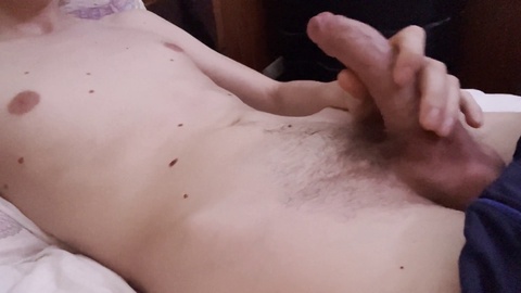 Young European teen has fun playing with his uncut cock and balls!
