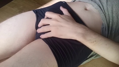 Horny twink boy erotically strokes his throbbing cock and moans in pleasure