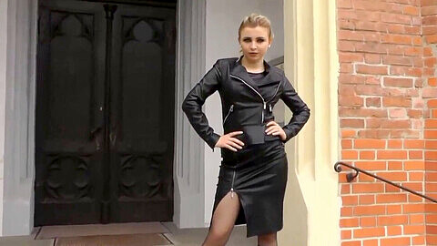 Seductive Mistress in Leather Dress Shows Off Her Power and Dominance Outdoors
